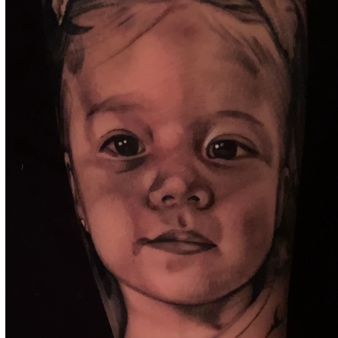 Baby portrait tattoo by Vegas Vic